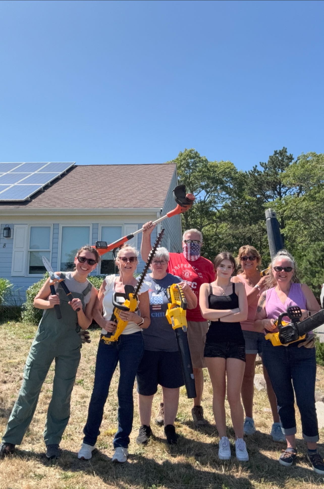 The Baldwin Group employees volunteering during their annual service day in Harwich MA coordinated through I Want To Mow Your Lawn