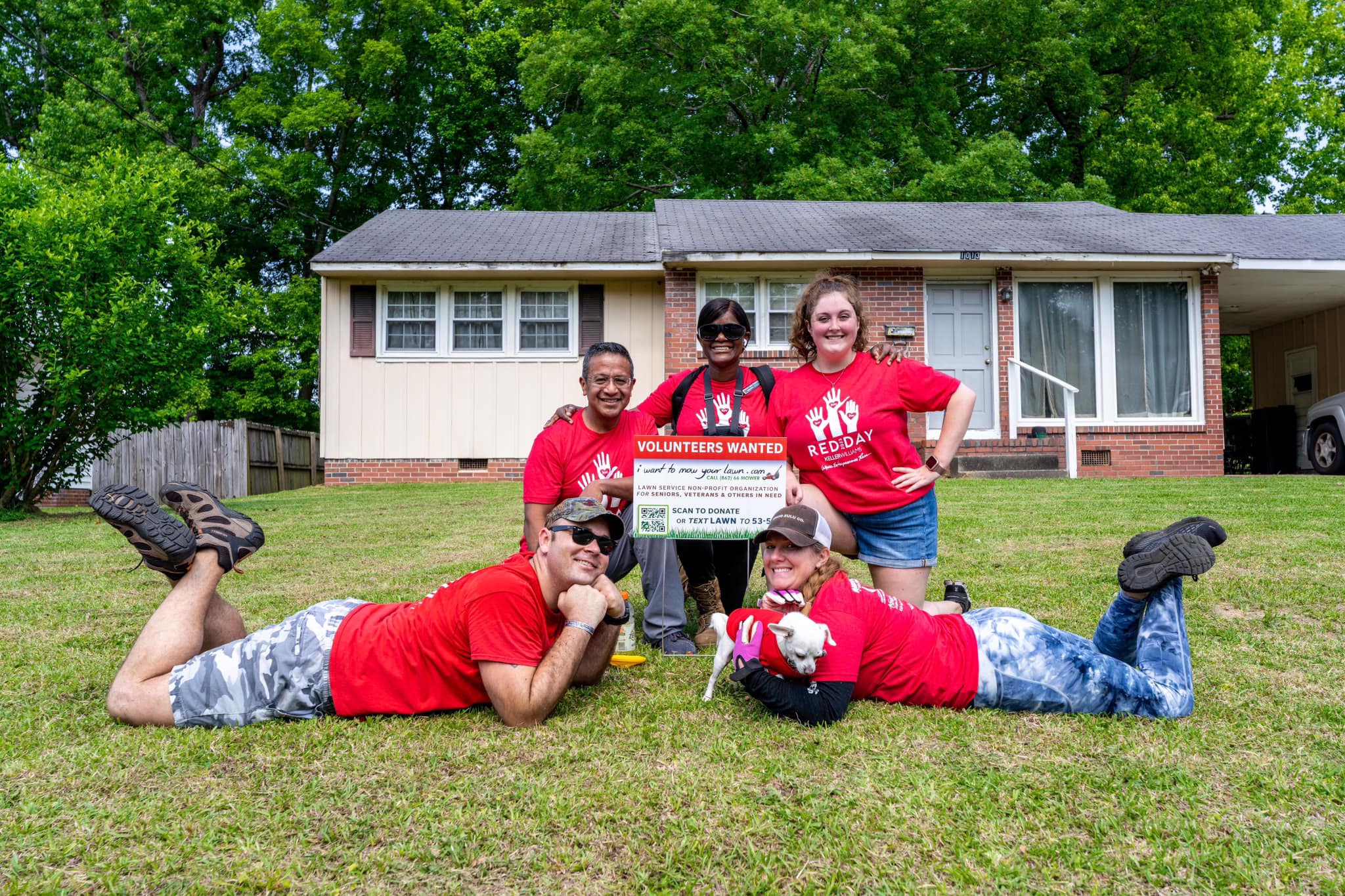 Keller Williams Realty Jackson NC team volunteering during Red Day, a corporate service day coordinated through I Want To Mow Your Lawn