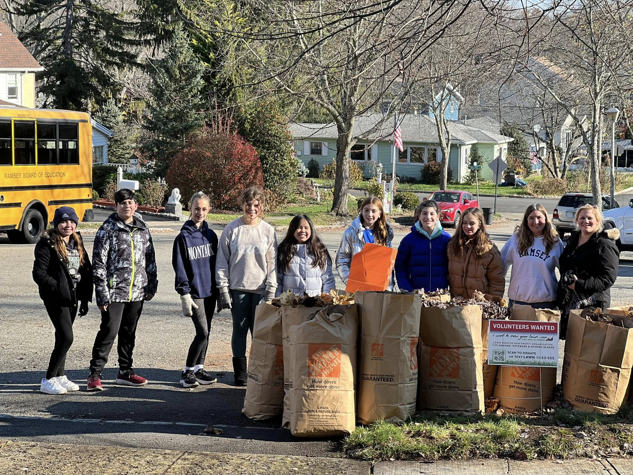 Ramsey NJ middle school students performing leaf removal for a local veteran during a board-approved school field day trip