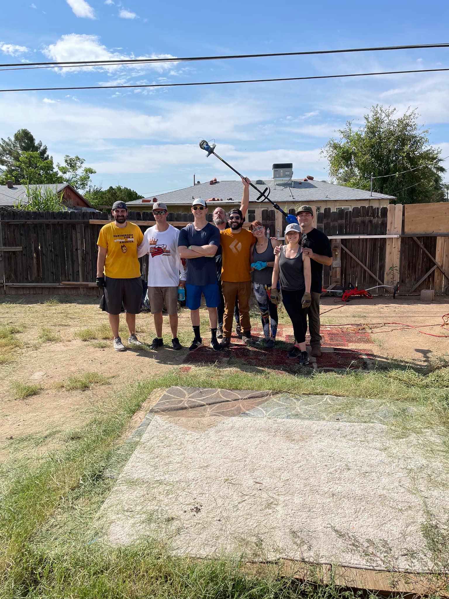 Weekend Warriors volunteers battling the heat to help an elderly man and his caretaker with property upkeep in Phoenix AZ
