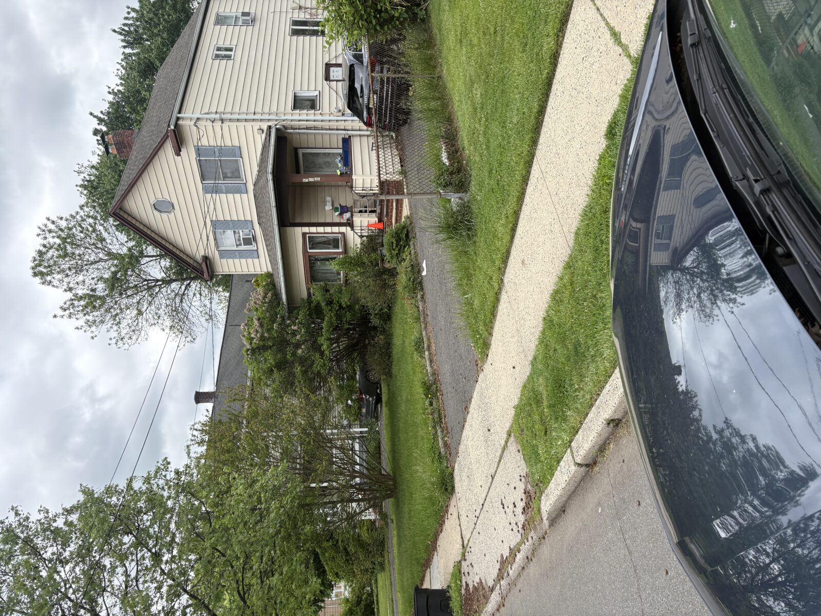 Privacy-protected yard photo submitted through Mow Notice in Garwood, NJ