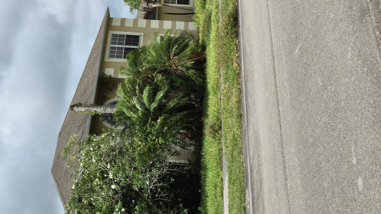 Privacy-protected yard photo submitted through Mow Notice in Vero Beach, FL