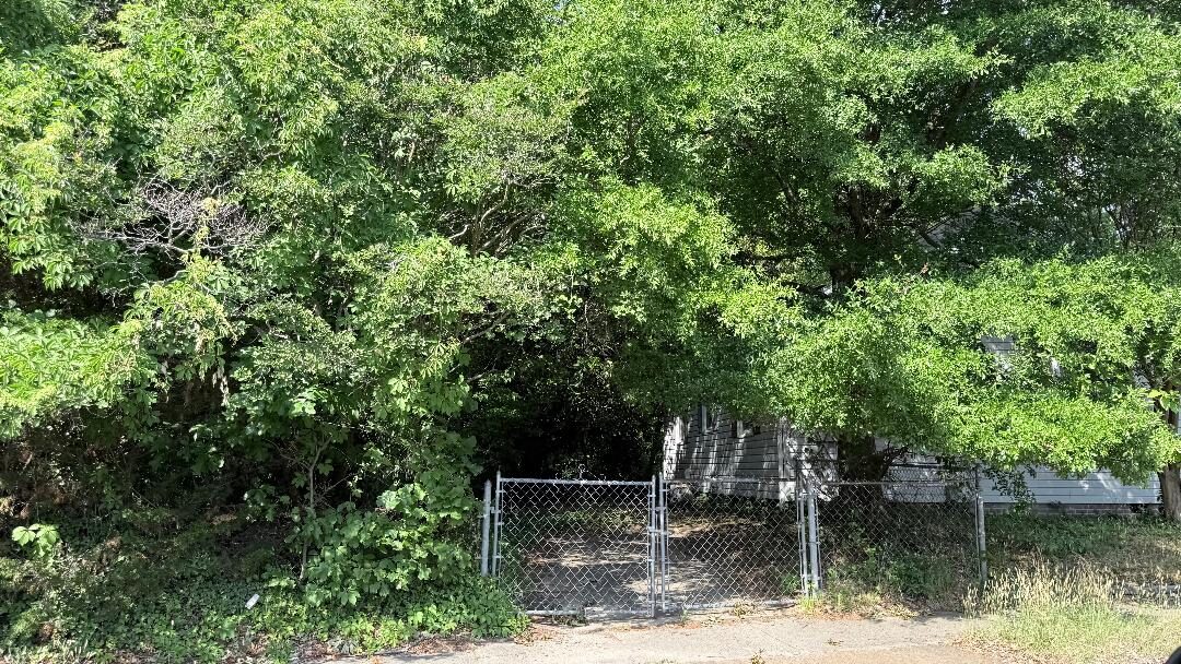 Privacy-protected yard photo submitted through Mow Notice in Norfolk, VA