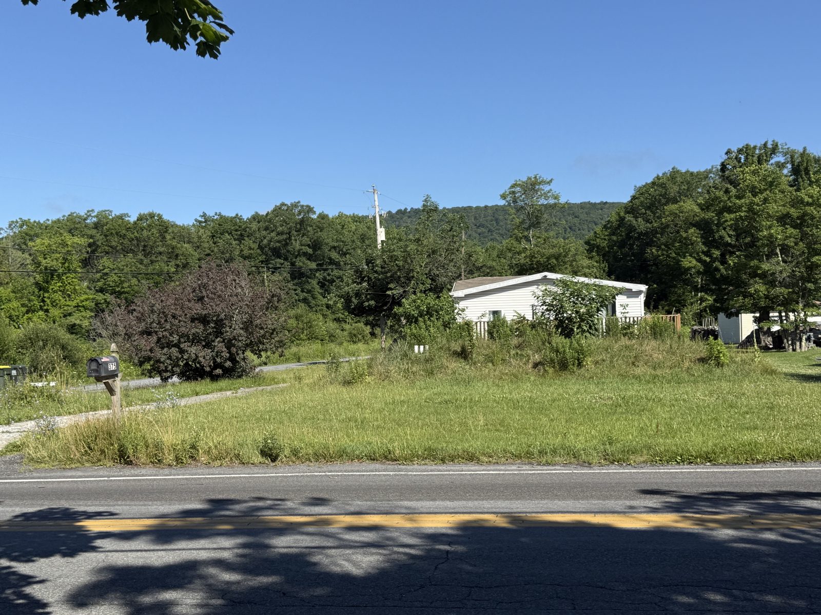 Privacy-protected yard photo submitted through Mow Notice in Wind Gap, PA